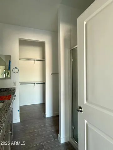 a view of hallway with wooden floor