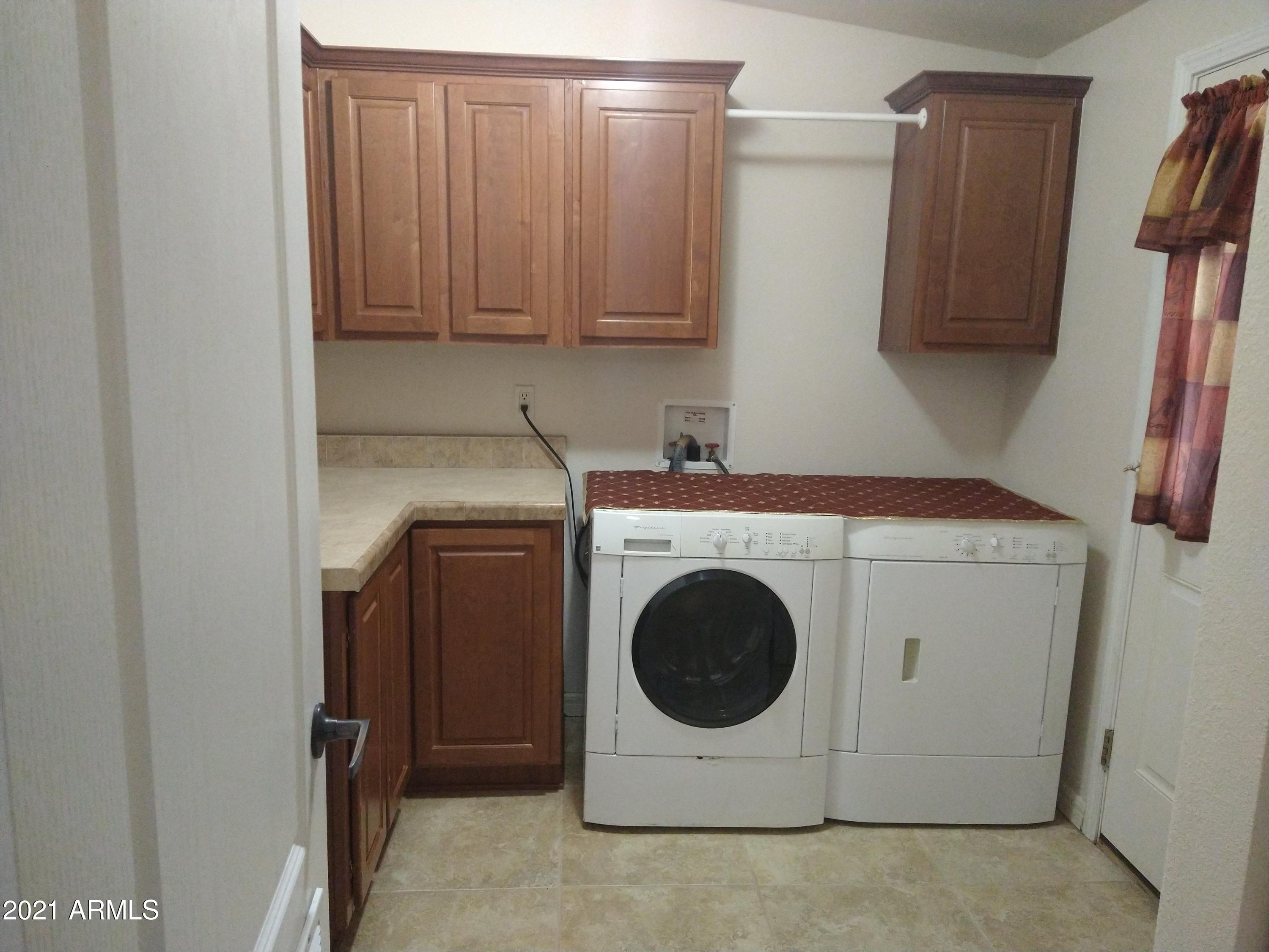 300 South Rim Rock Point Payson, AZ 85541 - Photo 39 of 40 Cabinets in Laundry Rm