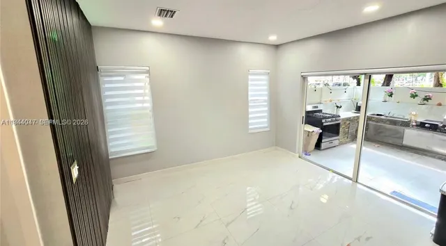 a room with window and furniture