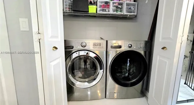 a utility room with dryer and washer