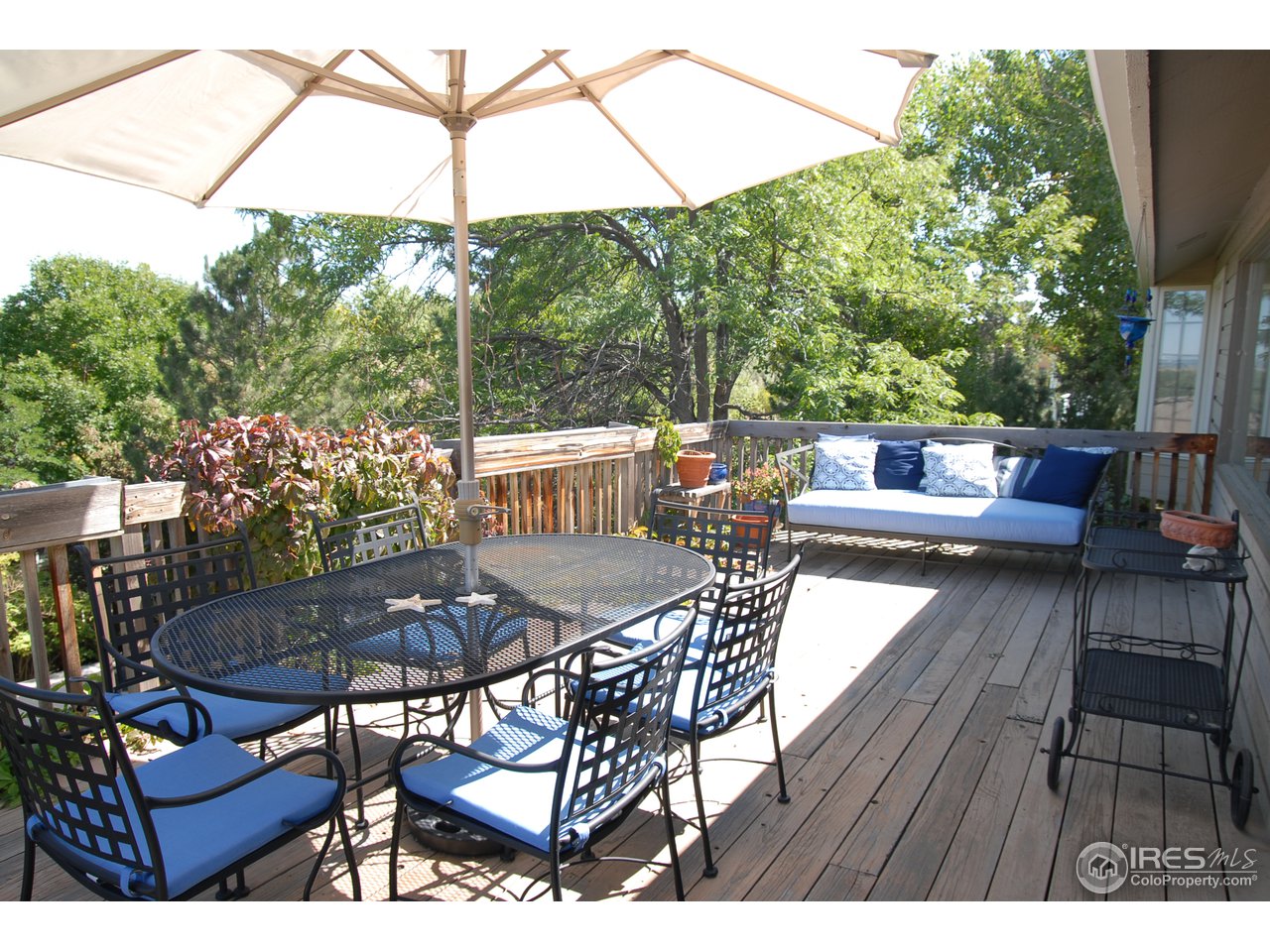 3830 Spring Valley Road Boulder, CO 80304 - Photo 15 of 18 a view of patio with table and chairs and potted plants