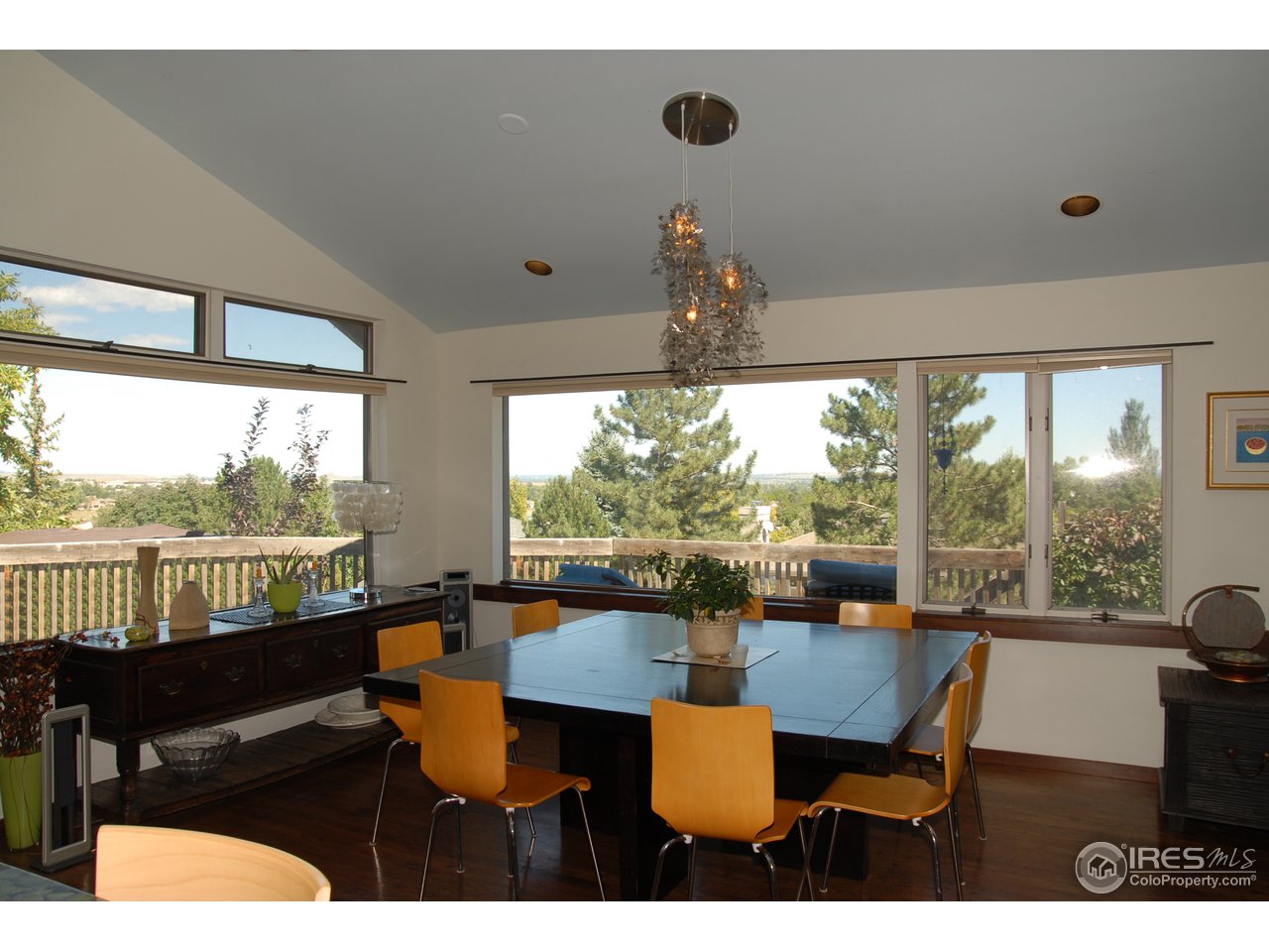 3830 Spring Valley Road Boulder, CO 80304 - Photo 18 of 18 a view of a dining room with furniture wooden floor and chandelier