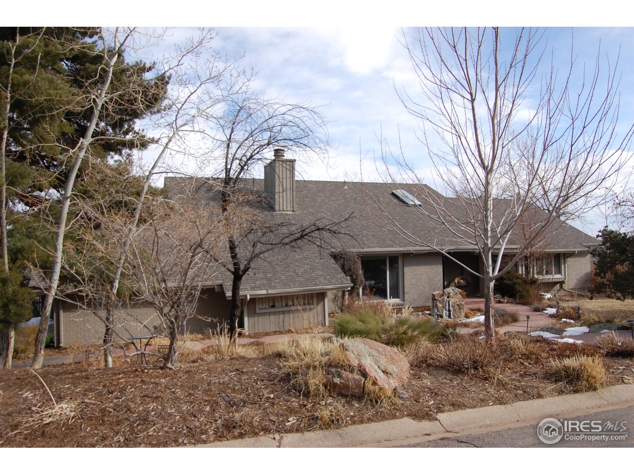 3830 Spring Valley Road Boulder, CO 80304 - Photo 2 of 18 a backyard of a house with large trees