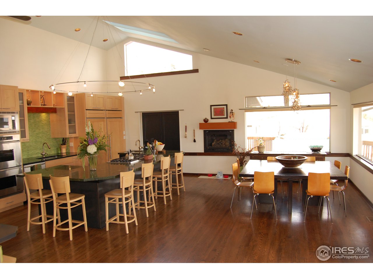 3830 Spring Valley Road Boulder, CO 80304 - Photo 3 of 18 a dining room with lots of furniture window and wooden floor