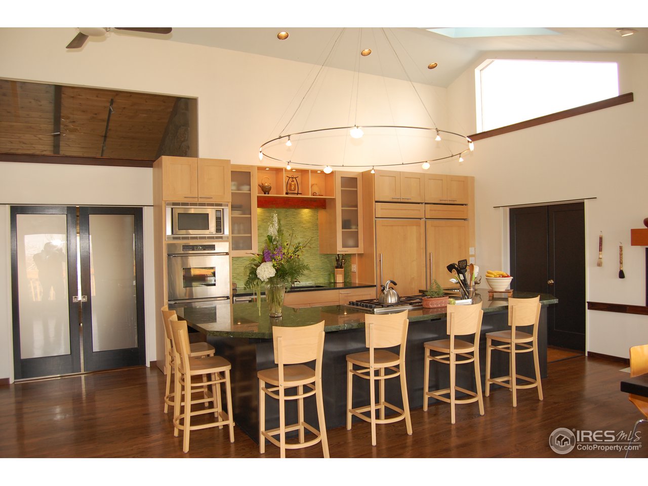 3830 Spring Valley Road Boulder, CO 80304 - Photo 5 of 18 a dining hall with stainless steel appliances kitchen island granite countertop a table and chairs