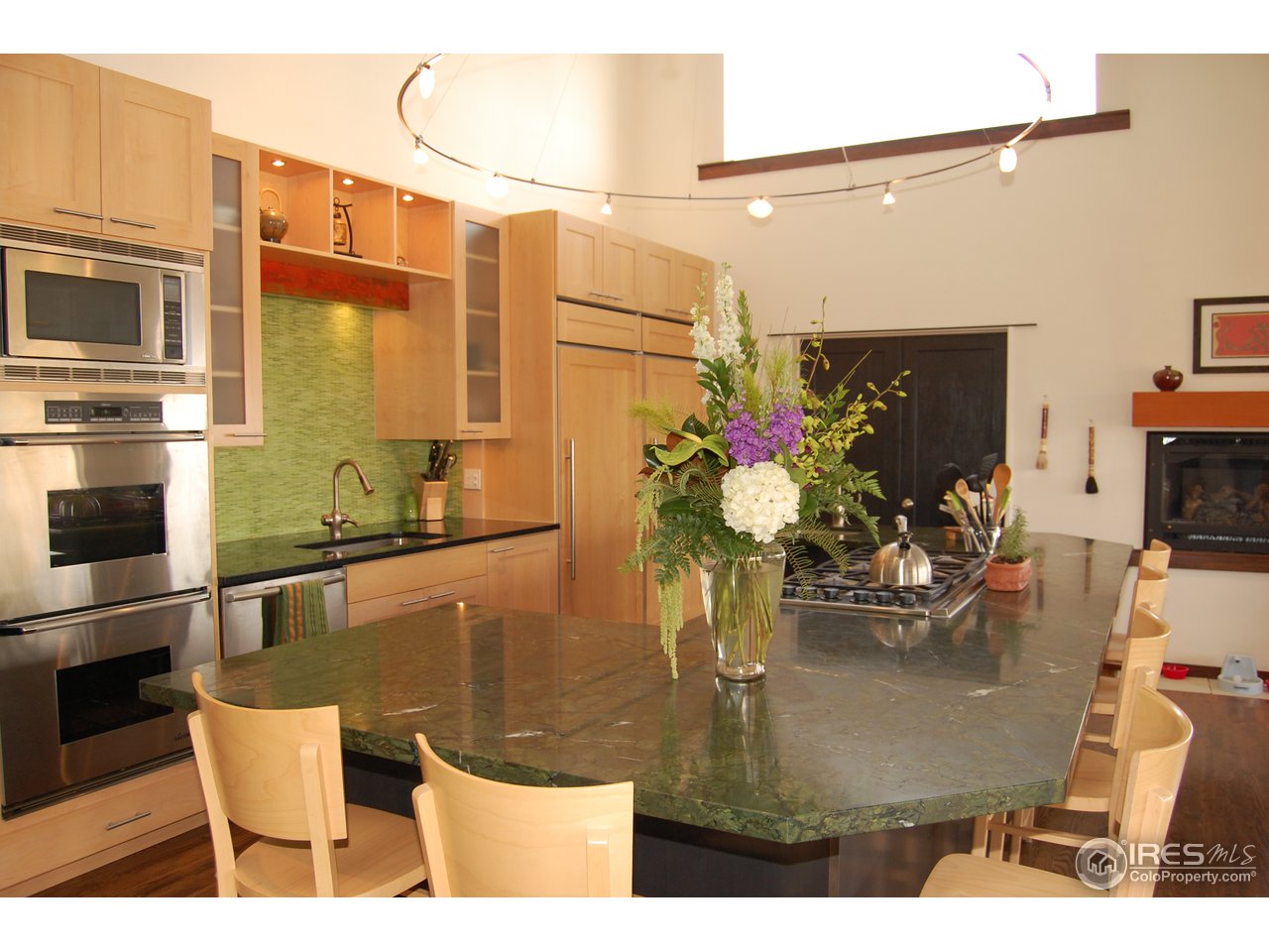 3830 Spring Valley Road Boulder, CO 80304 - Photo 6 of 18 a dining table with chairs and flower pot
