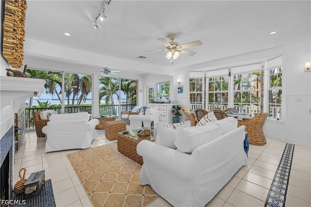 515 Useppa Useppa Island Bokeelia, FL 33922 - Photo 14 of 43 a living room with furniture and a large window
