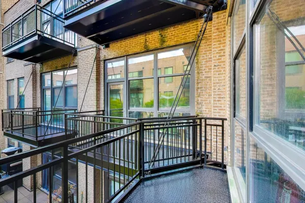 a view of a balcony with a potted plant