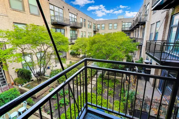 a view of a balcony with an outdoor street