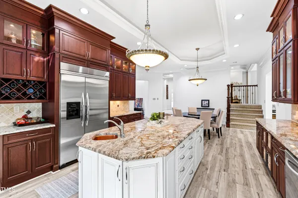 a bathroom with a granite countertop double vanity sink and a mirror