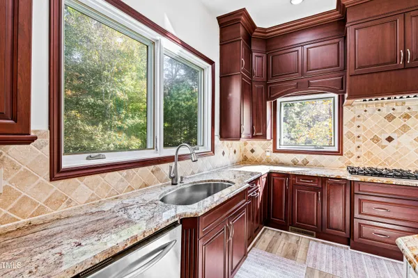 a bathroom with a sink and a window