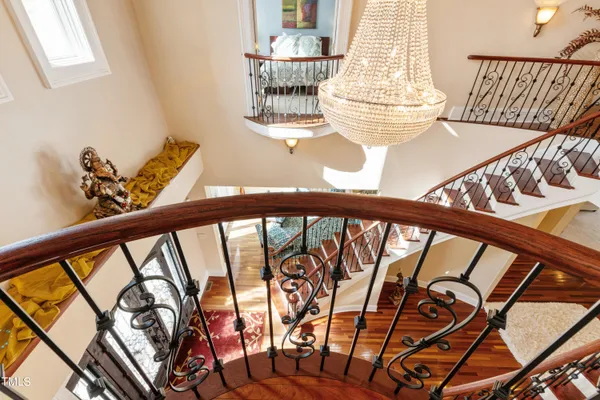 a view of a balcony with a yard