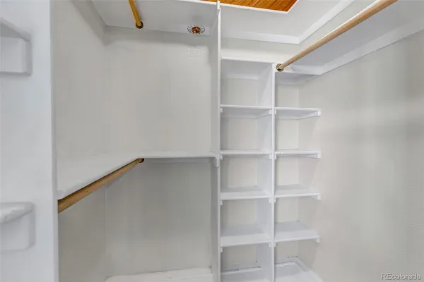 a view of an empty walk in closet