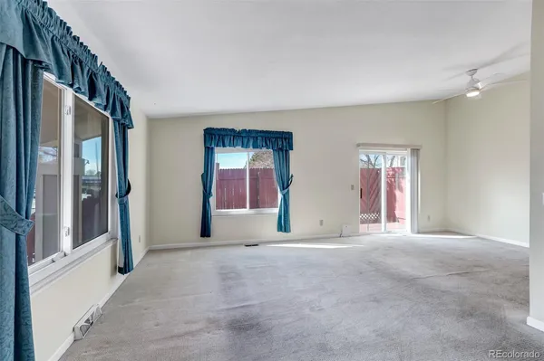 a view of empty room with windows