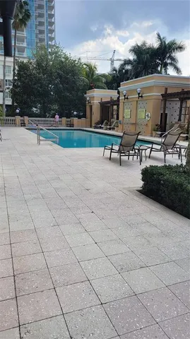 a view of swimming pool with outdoor seating
