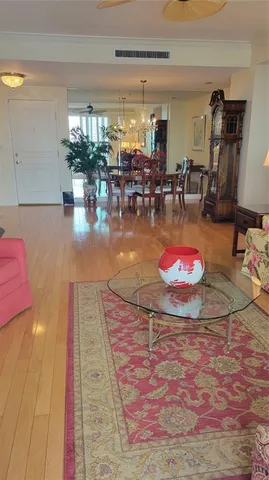 a bed sitting in a bedroom next to a wooden floor