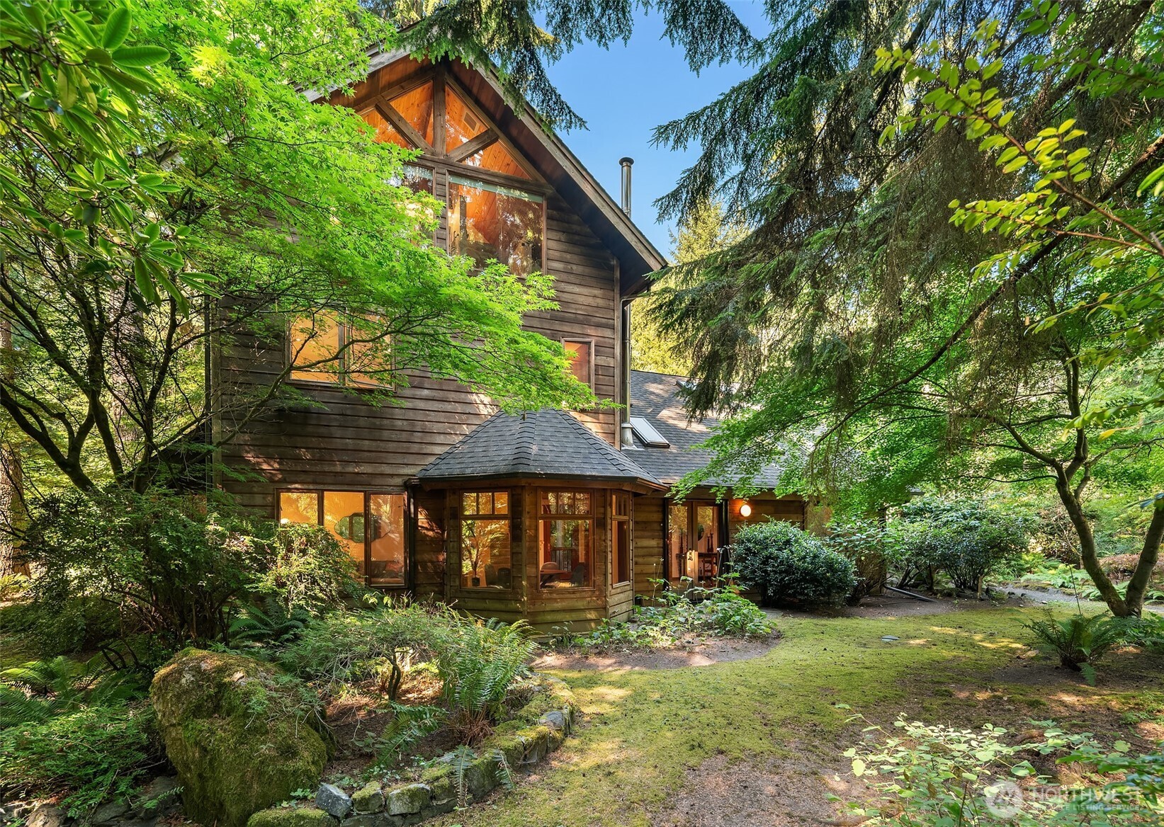 17804 Thorsen Road Southwest Vashon, WA 98070 - Photo 1 of 39 a front view of a house with garden