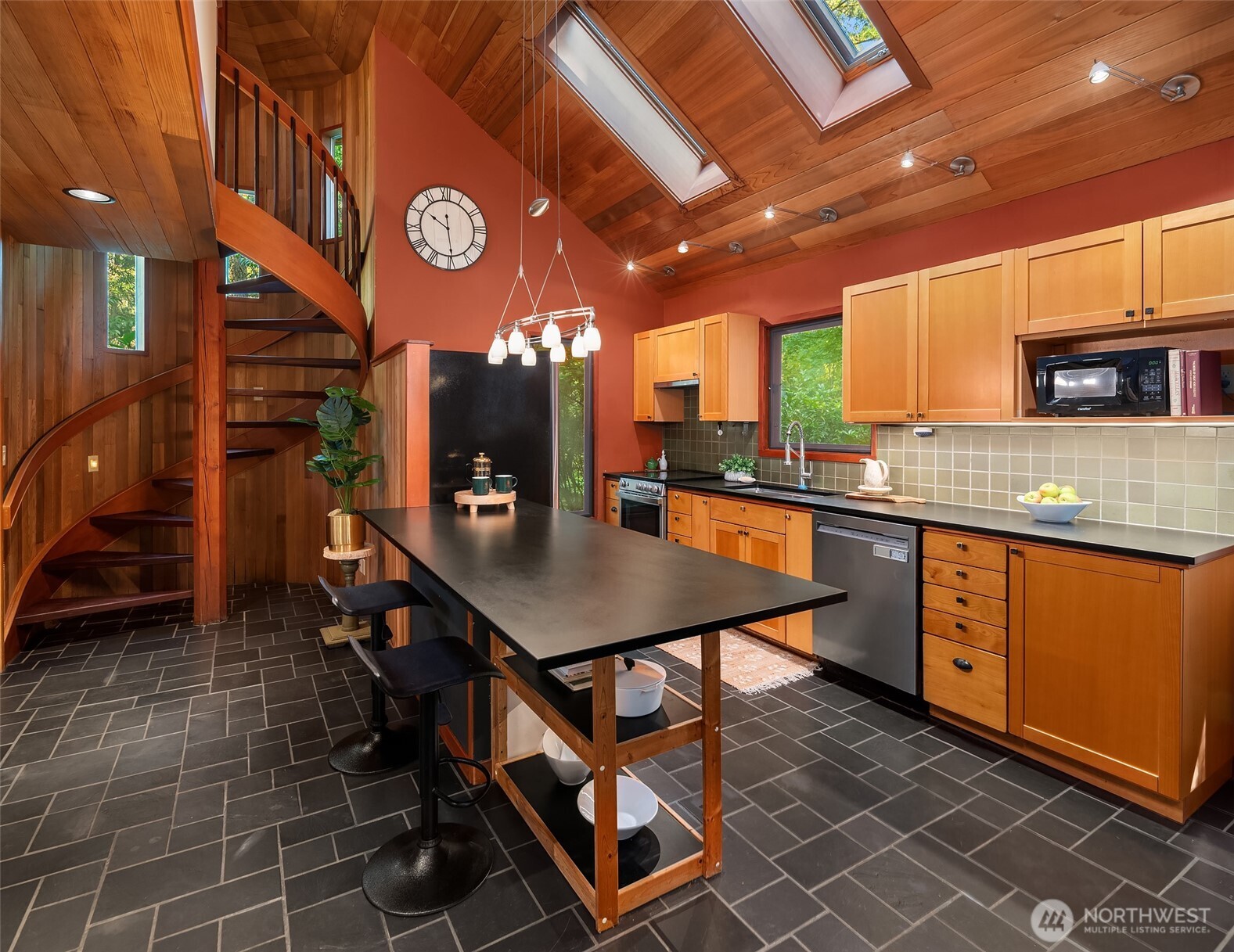 17804 Thorsen Road Southwest Vashon, WA 98070 - Photo 16 of 39 a kitchen with stainless steel appliances granite countertop a sink a stove counter space and cabinets