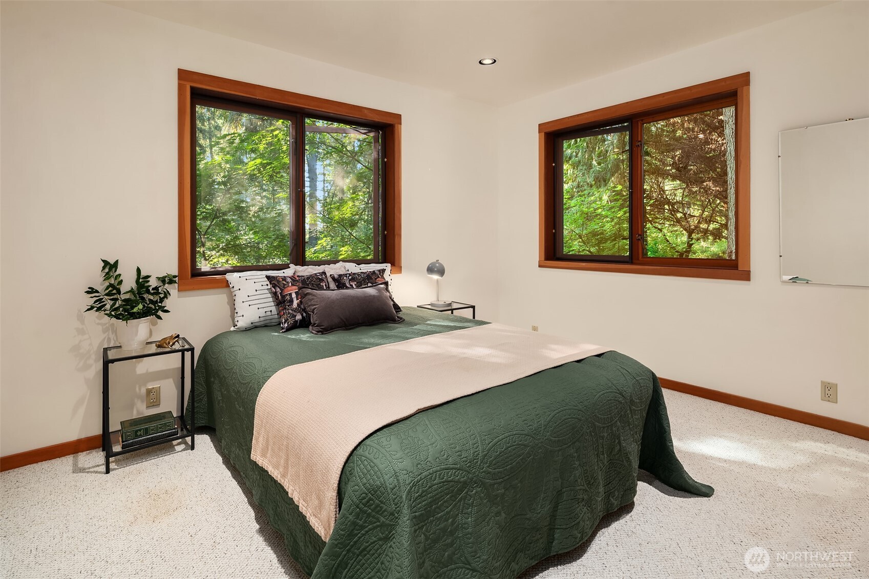 17804 Thorsen Road Southwest Vashon, WA 98070 - Photo 24 of 39 a bedroom with a bed and a window