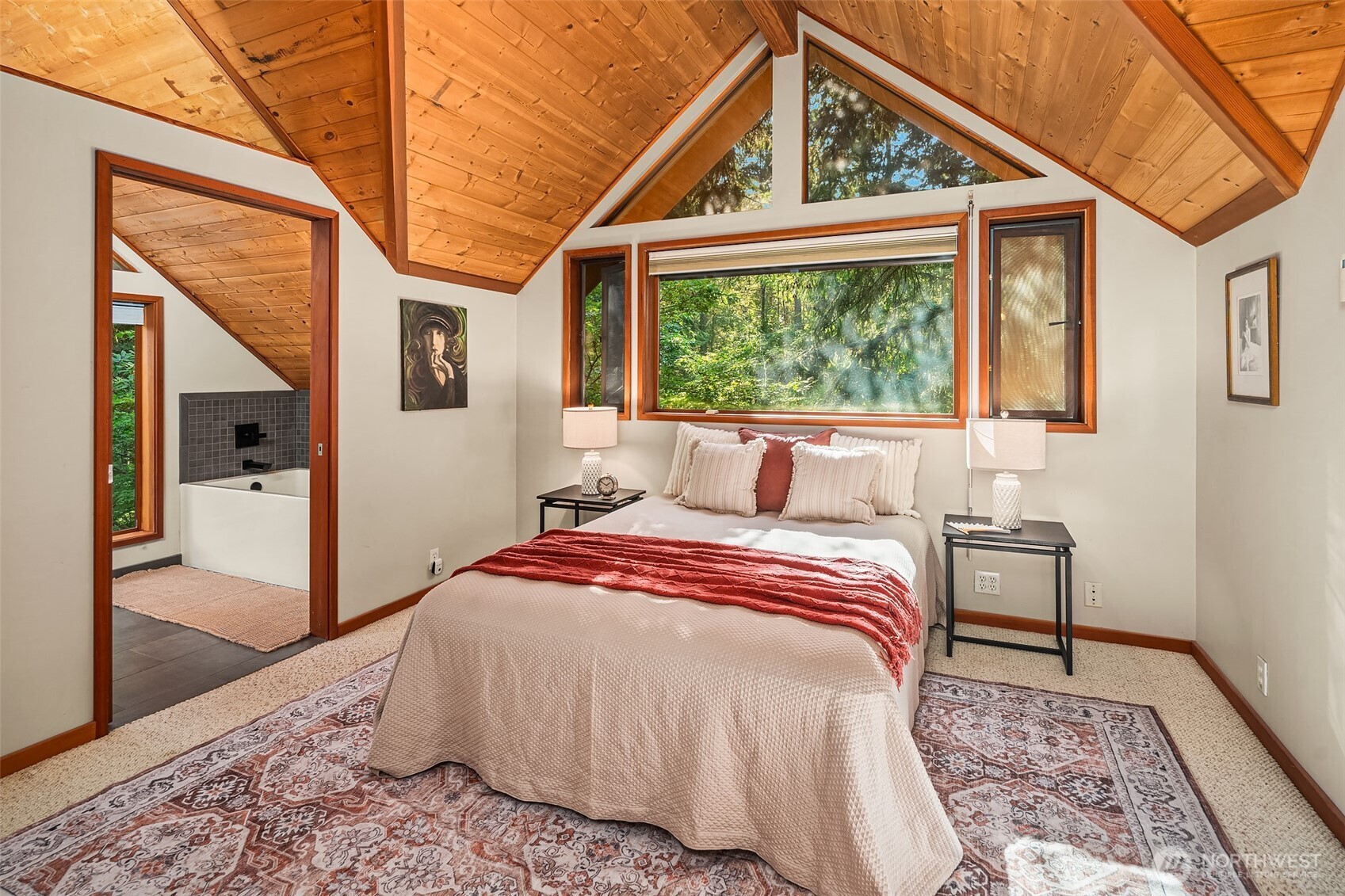 17804 Thorsen Road Southwest Vashon, WA 98070 - Photo 27 of 39 a bed sitting in a bedroom next to a window