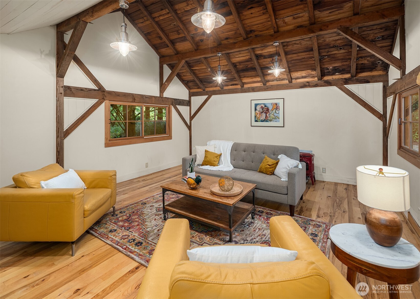 17804 Thorsen Road Southwest Vashon, WA 98070 - Photo 32 of 39 a living room with furniture and a wooden floor