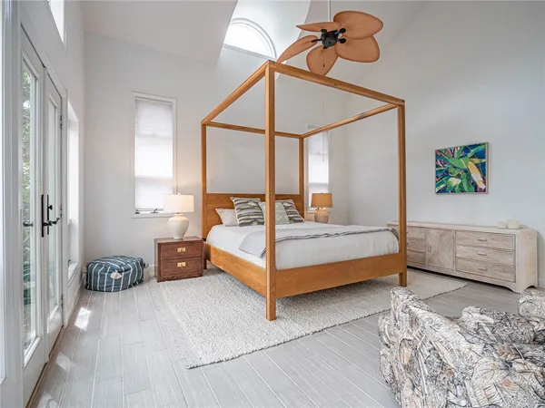 a bedroom with furniture and a window