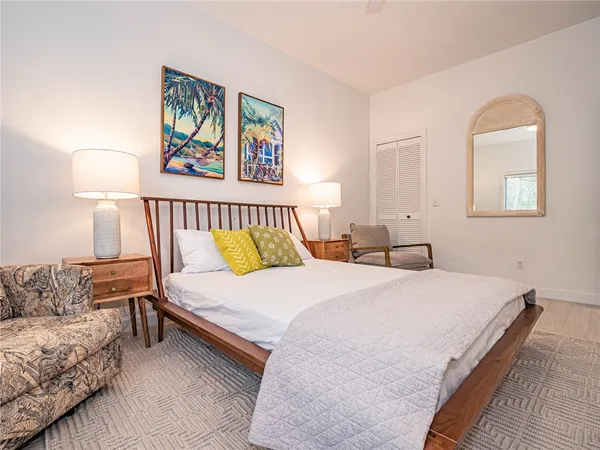 a bedroom with bed and a couch