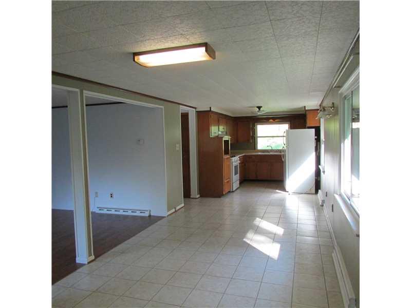 287 Noll Road Georgetown, PA 15043 - Photo 3 of 14 Dining Room. Open dining room & kitchen. Ceramic tile floor.
