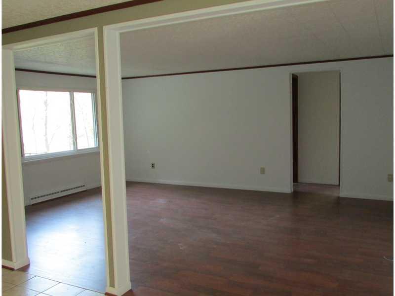 287 Noll Road Georgetown, PA 15043 - Photo 5 of 14 Living Room. Laminate flooring in living room.