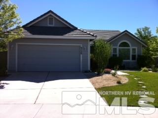 9720 Oakley Court Reno, NV 89521 - Photo 1 of 1 a front view of a house with a yard
