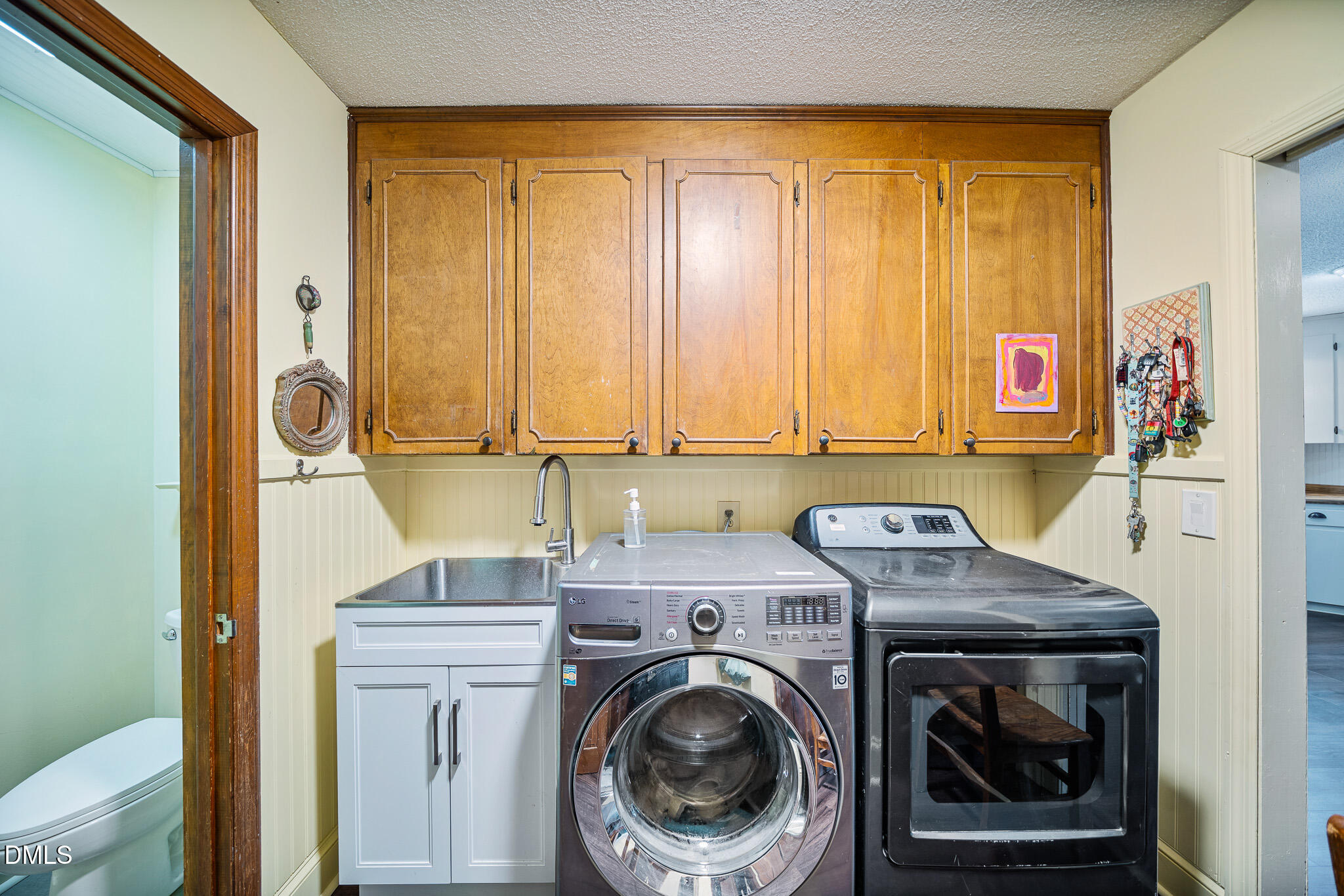 79 South Pleasant Street Angier, NC 27501 - Photo 17 of 52 a utility room with dryer and washer