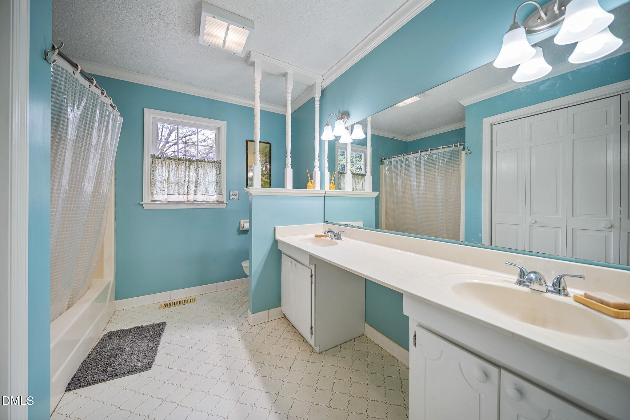 79 South Pleasant Street Angier, NC 27501 - Photo 21 of 52 a bathroom with a sink and a mirror