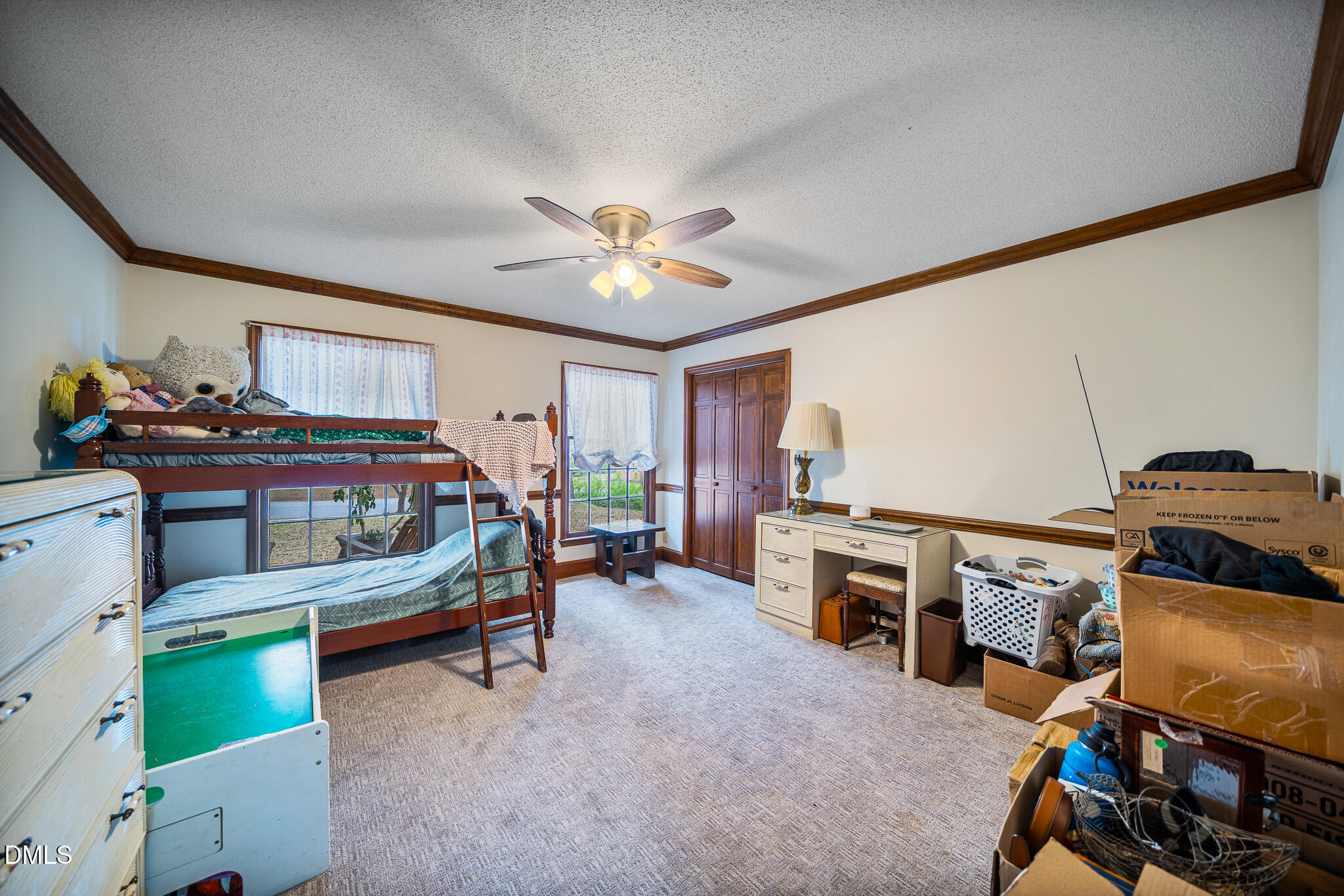 79 South Pleasant Street Angier, NC 27501 - Photo 22 of 52 a bedroom with furniture and a baby crib