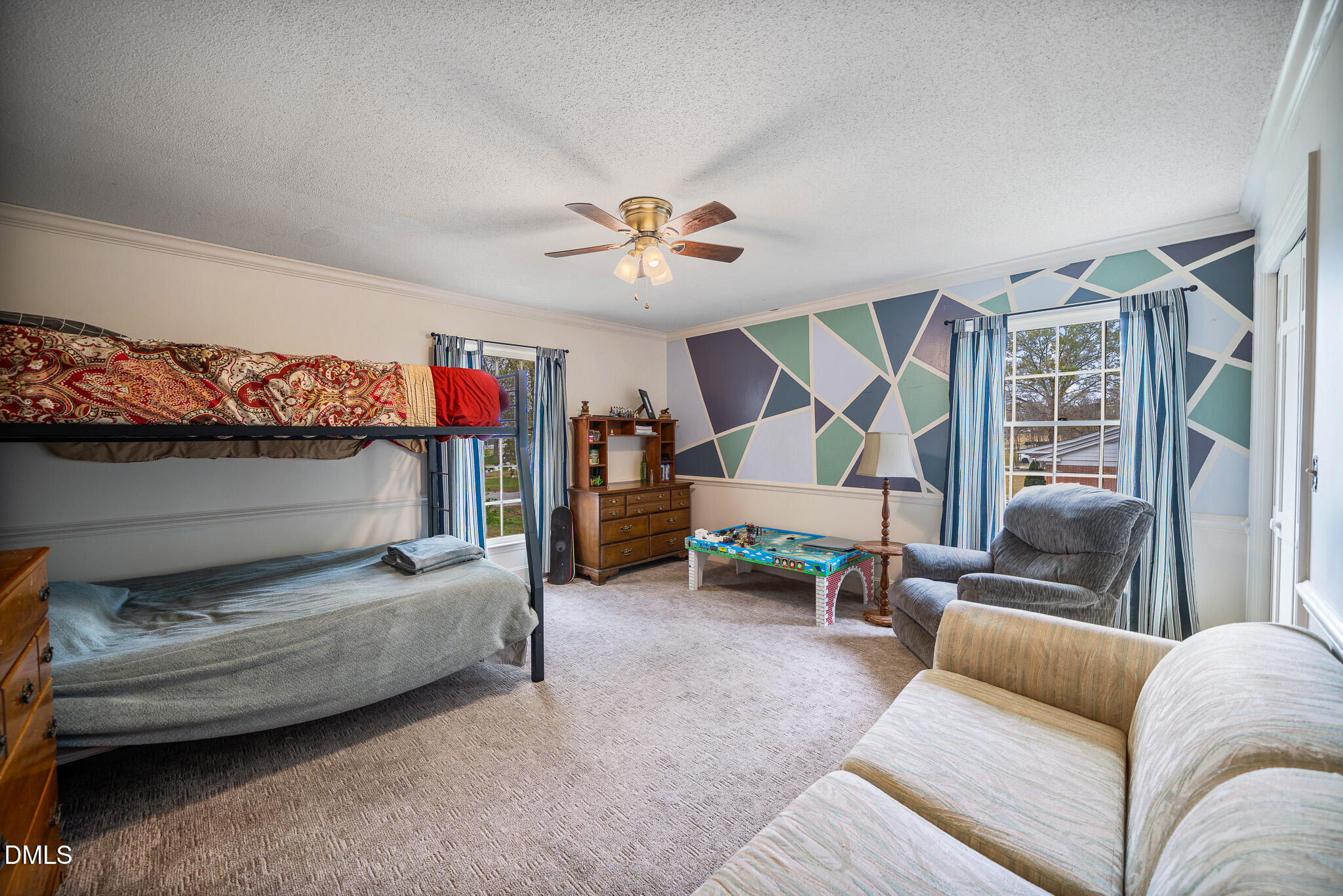 79 South Pleasant Street Angier, NC 27501 - Photo 24 of 52 a bedroom with furniture and a couch