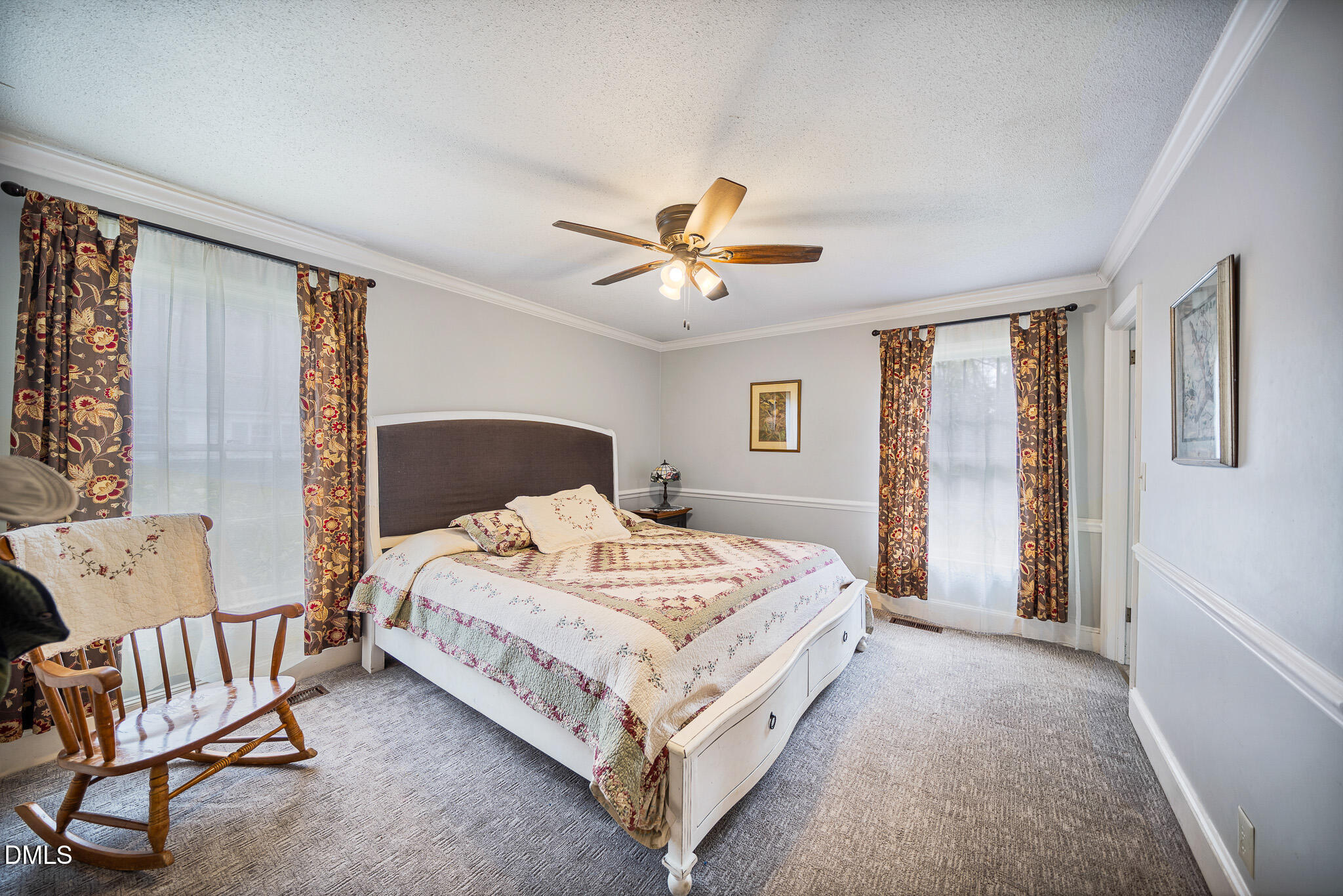 79 South Pleasant Street Angier, NC 27501 - Photo 27 of 52 a bedroom with a bed couch and windows