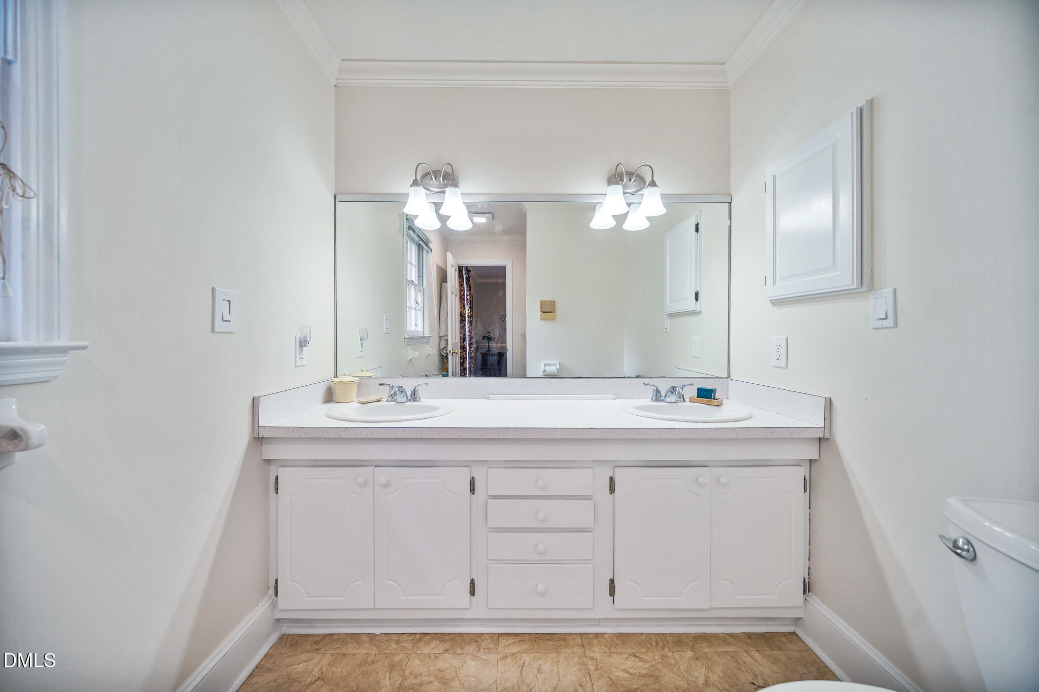 79 South Pleasant Street Angier, NC 27501 - Photo 30 of 52 a bathroom with a sink a mirror and a light fixture