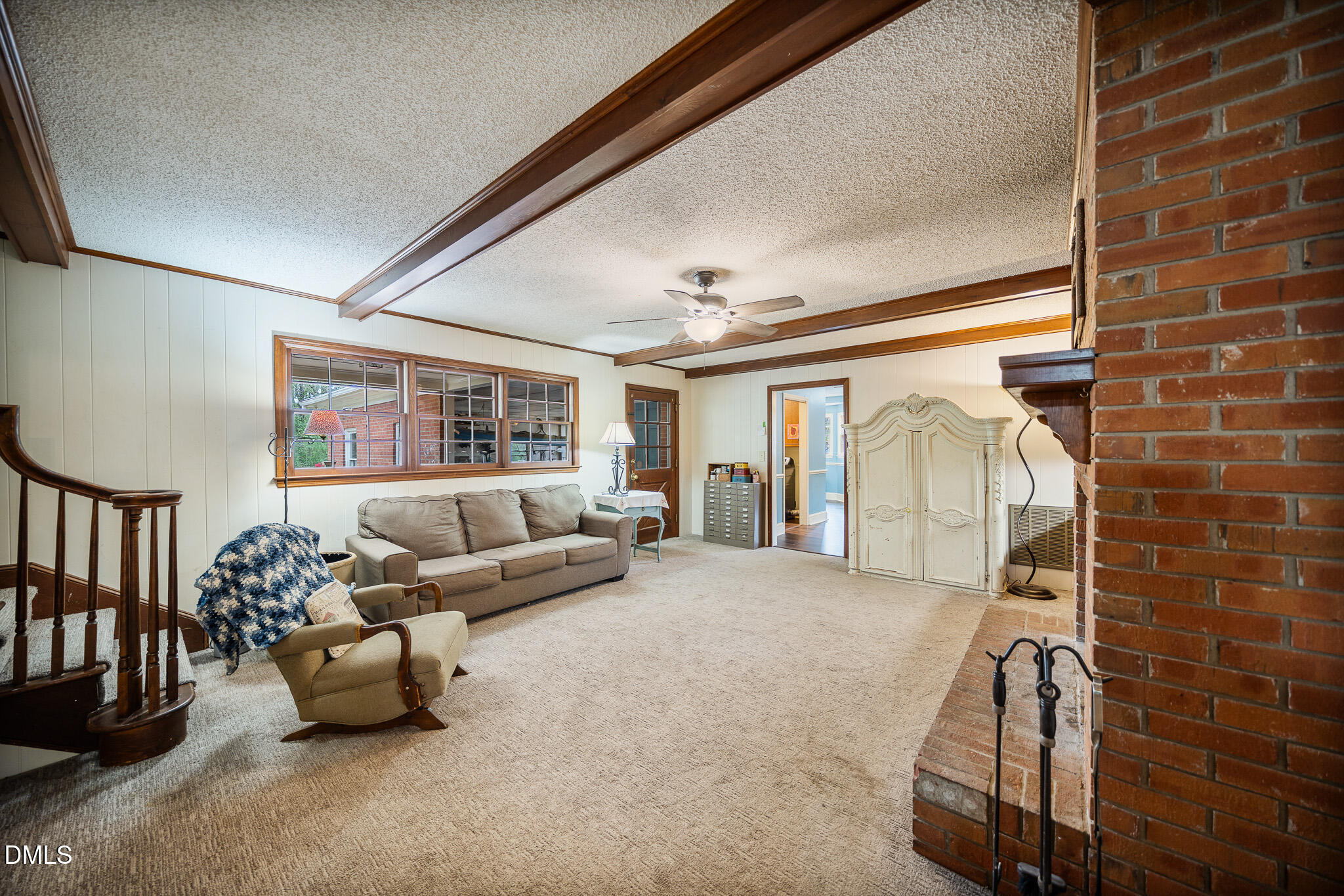 79 South Pleasant Street Angier, NC 27501 - Photo 34 of 52 a living room with furniture and a floor to ceiling window