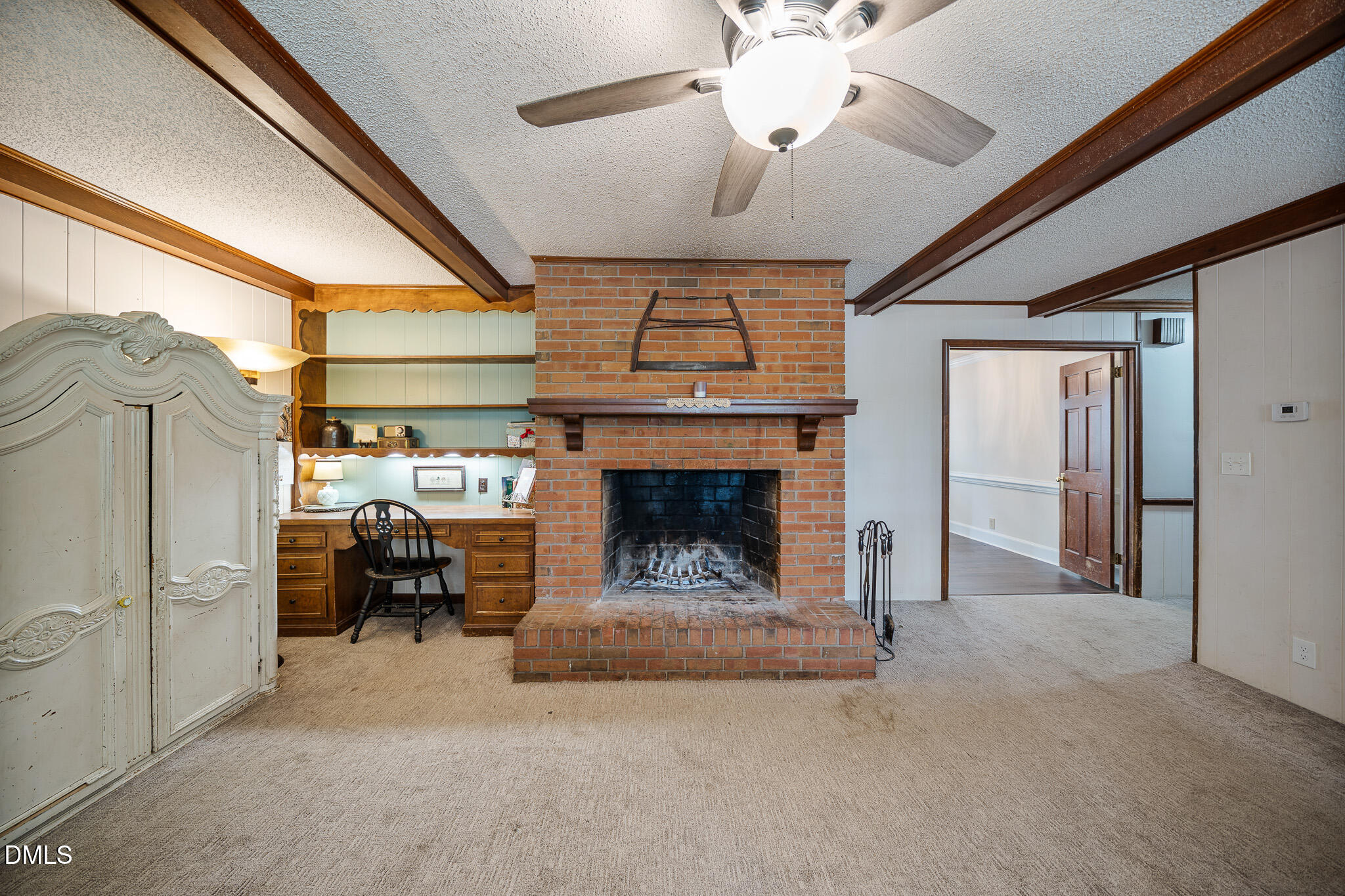 79 South Pleasant Street Angier, NC 27501 - Photo 35 of 52 a living room with furniture a fireplace and a chandelier