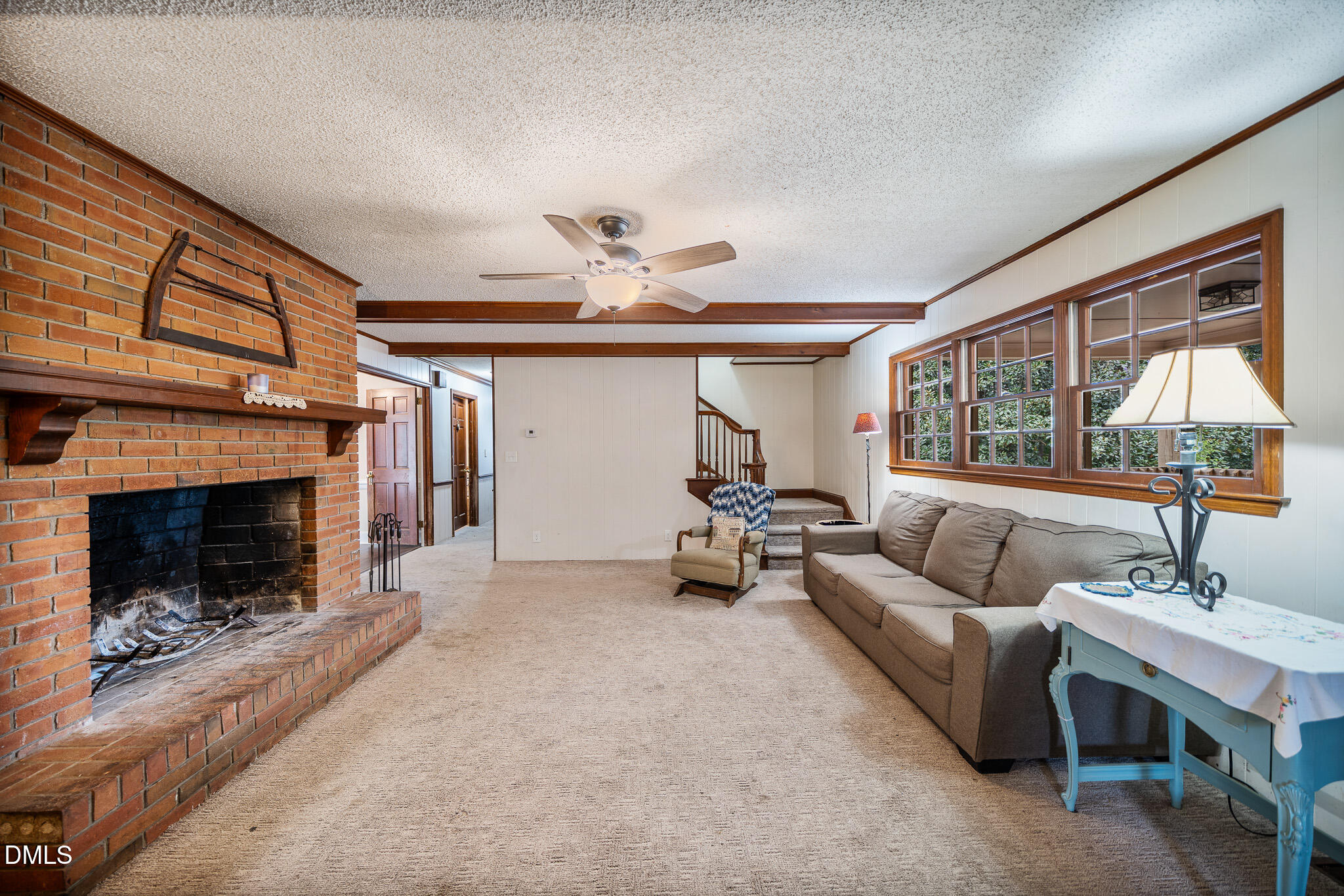 79 South Pleasant Street Angier, NC 27501 - Photo 36 of 52 a living room with furniture and a fireplace