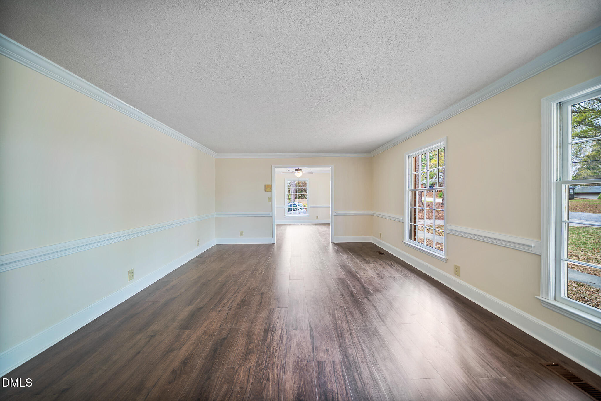 79 South Pleasant Street Angier, NC 27501 - Photo 4 of 52 wooden floor in an empty room with a window