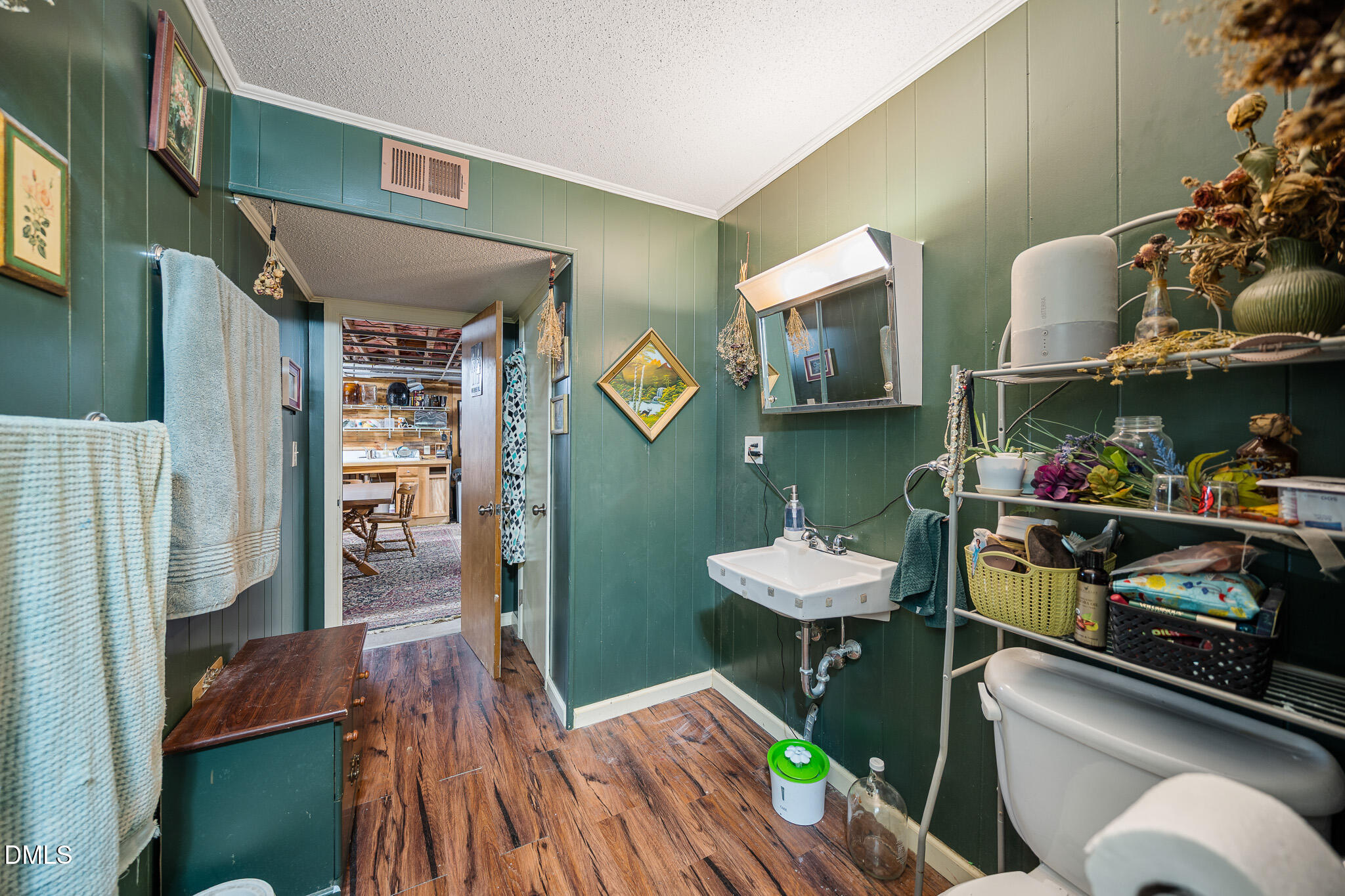 79 South Pleasant Street Angier, NC 27501 - Photo 42 of 52 a room with furniture and a wooden floor