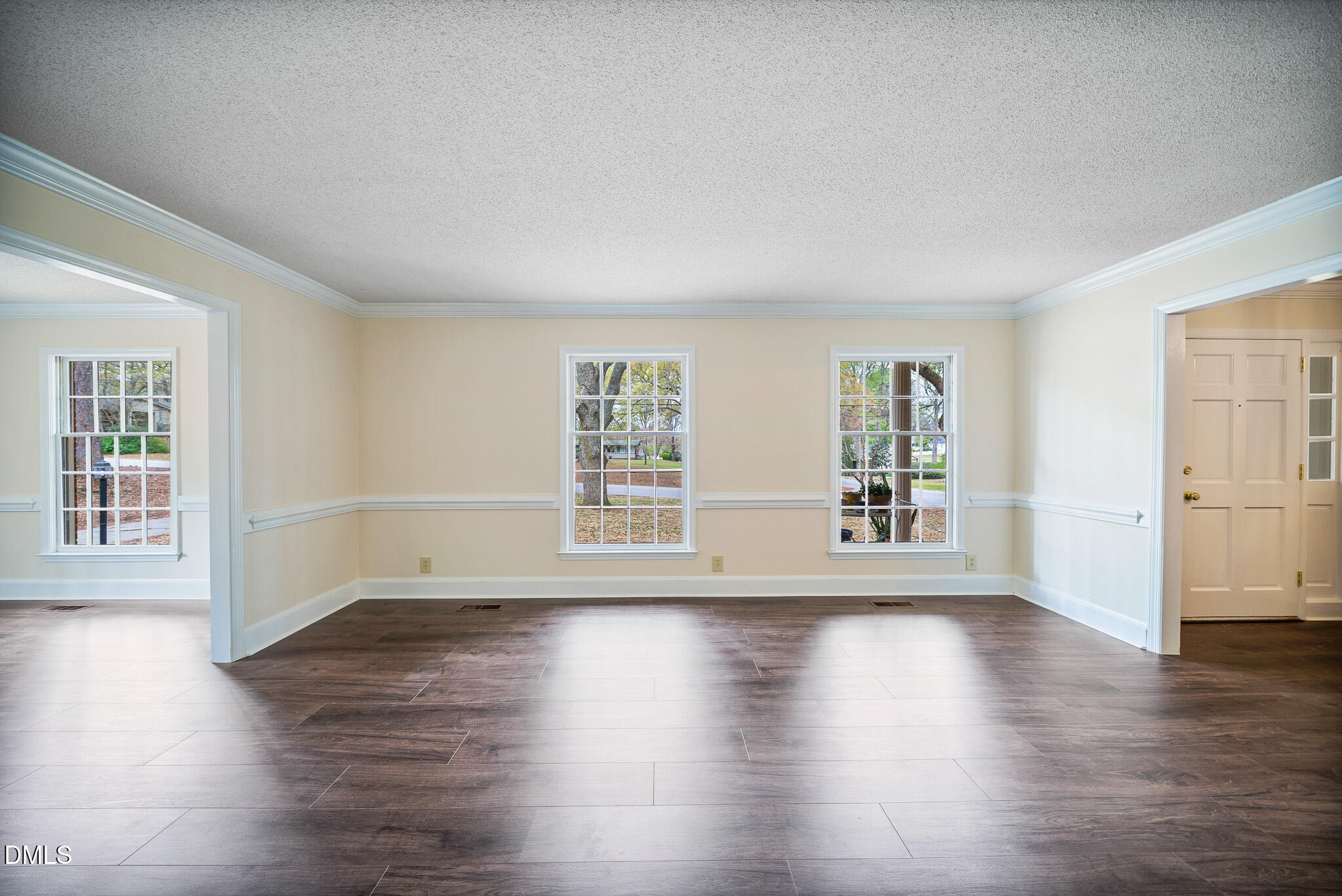 79 South Pleasant Street Angier, NC 27501 - Photo 5 of 52 a view of an empty room with wooden floor and a window