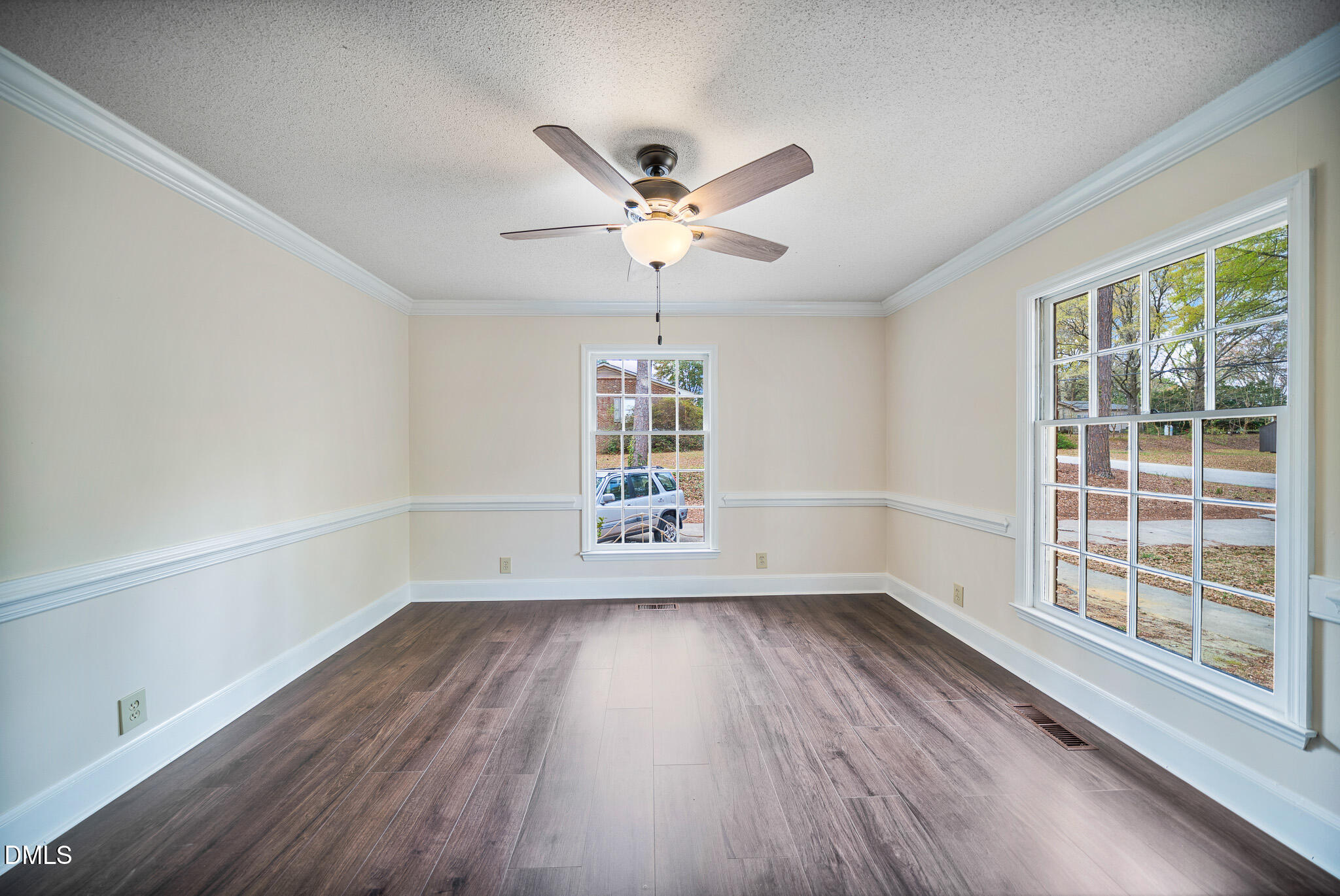 79 South Pleasant Street Angier, NC 27501 - Photo 6 of 52 wooden floor in an empty room with a window