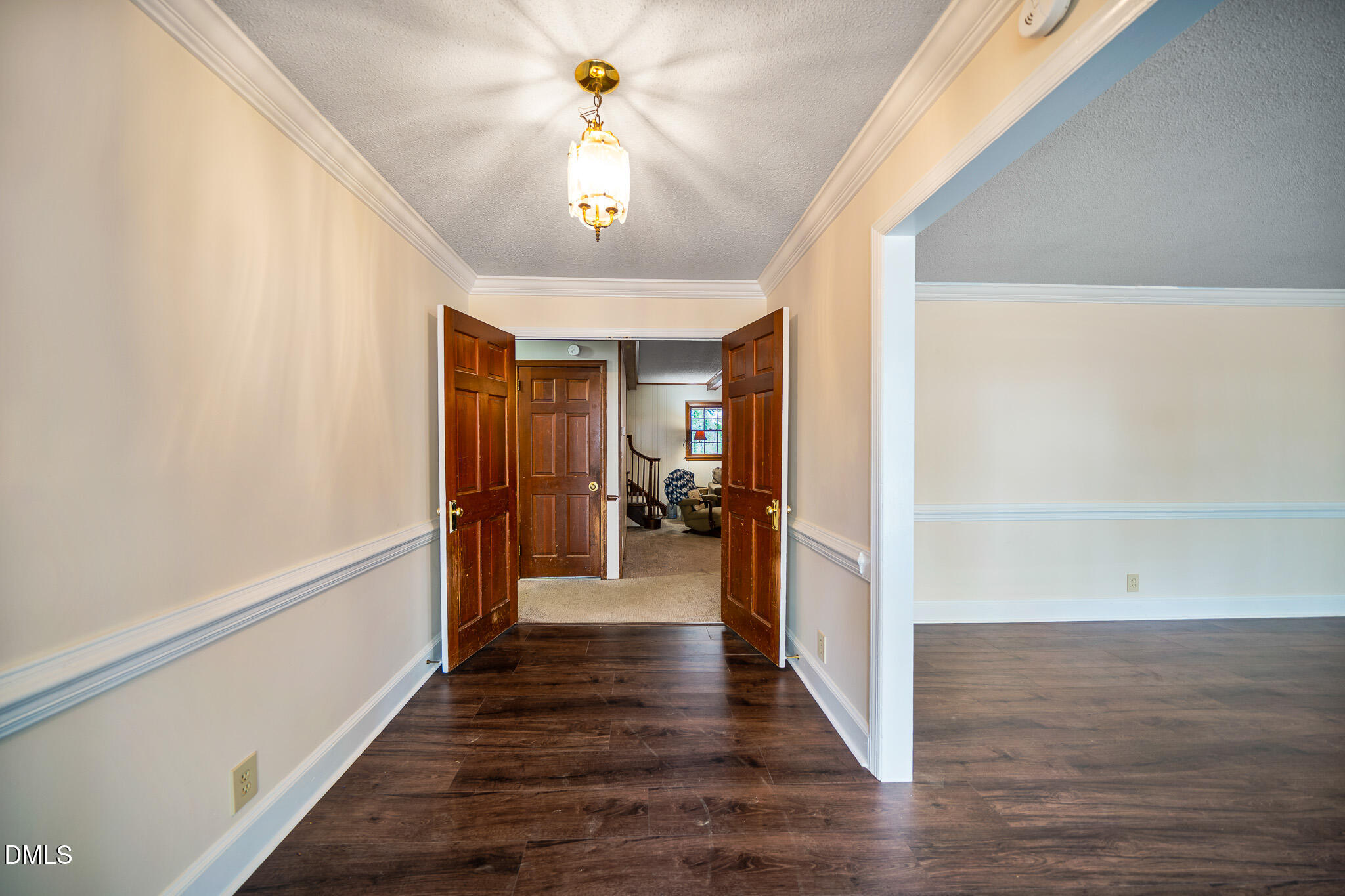 79 South Pleasant Street Angier, NC 27501 - Photo 8 of 52 a view of a hallway view with wooden floor and staircase