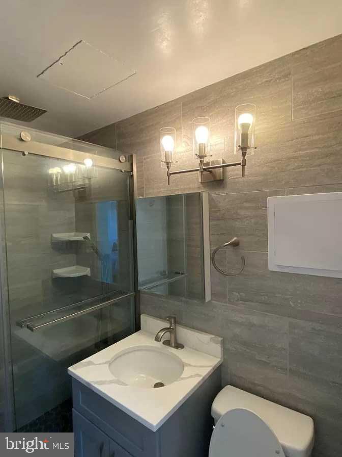 1011 Arlington Boulevard, Unit 1030 Arlington, VA 22209 - Photo 11 of 26 a bathroom with a sink toilet and shower