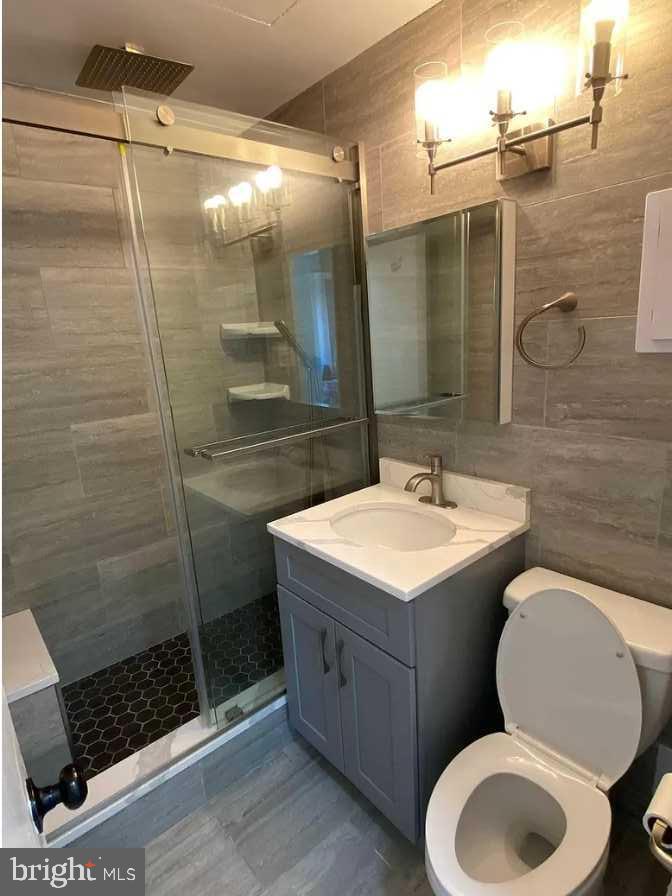 1011 Arlington Boulevard, Unit 1030 Arlington, VA 22209 - Photo 12 of 26 a bathroom with a sink toilet and shower