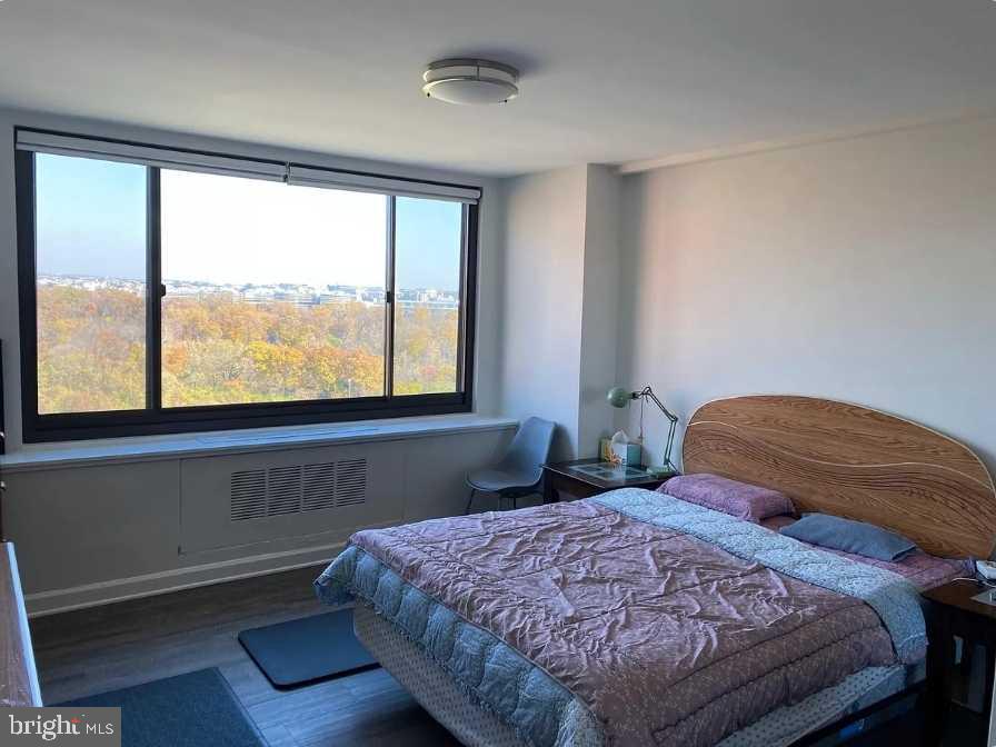 1011 Arlington Boulevard, Unit 1030 Arlington, VA 22209 - Photo 14 of 26 a bedroom with a bed and a window