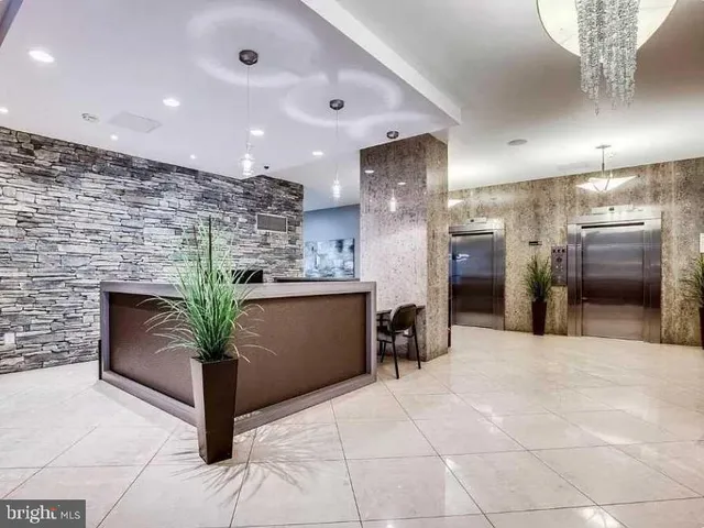 a living room with lots of white furniture