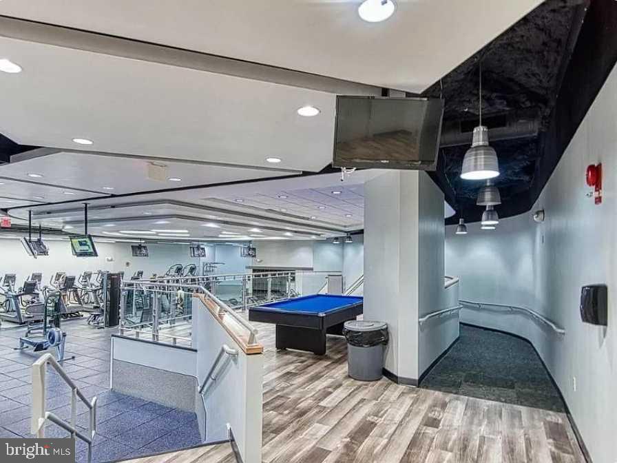 1011 Arlington Boulevard, Unit 1030 Arlington, VA 22209 - Photo 23 of 26 a kitchen with a sink and wooden floor