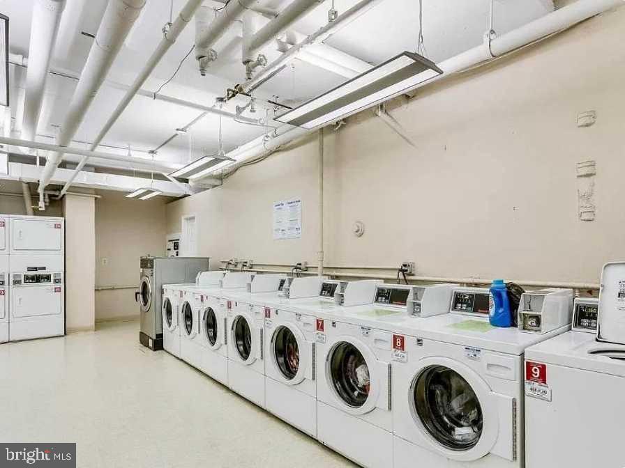1011 Arlington Boulevard, Unit 1030 Arlington, VA 22209 - Photo 24 of 26 a utility room with dryer and washer